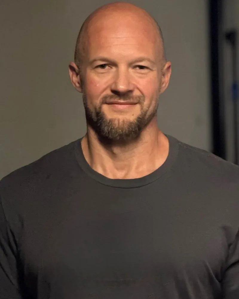 Casey McBride, executive coach, smiling.