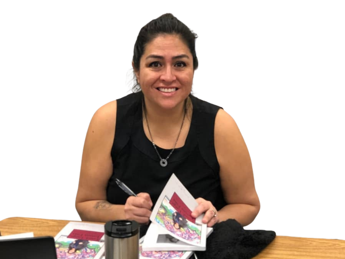 Yamile "Yaya" McBride signing copies of Loud, Large, Latina Fina.