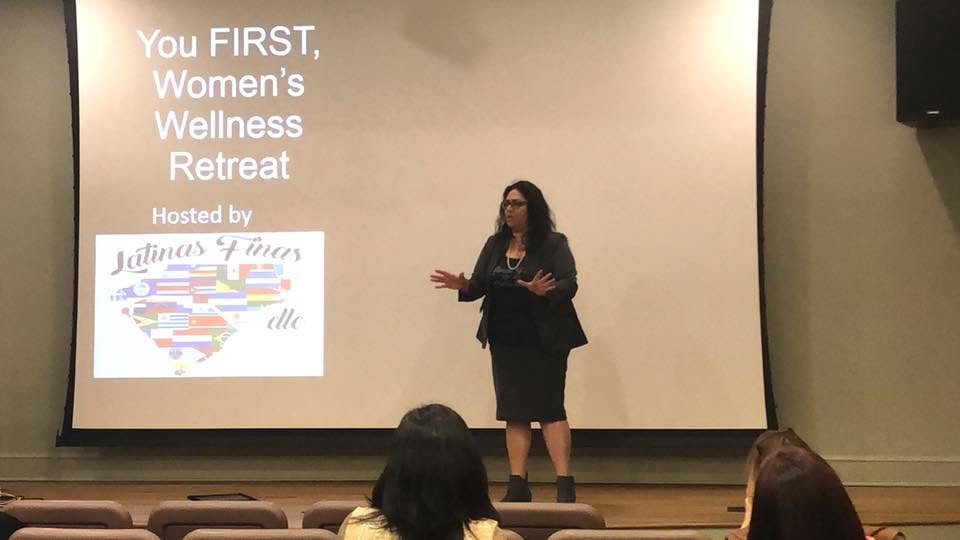 Yamile "Yaya" McBride facilitating a women's wellness retreat.