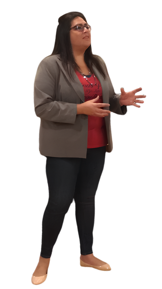 Yamile "Yaya" McBride speaking to an audience, mid-gesture.